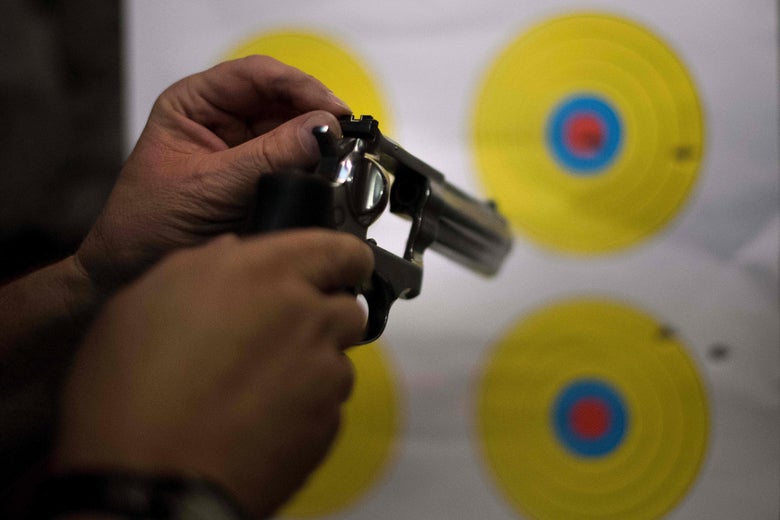 A man adjusts the sights on his .357 revolver at the Lynchburg Arms & Indoor Shooting Range in Lynchburg, Virginia, on October 20, 2017.
Virginia residents go to the polls on November 7 to vote for governor and members of the state's legislature. Following a mass shooting in Las Vegas that killed 58 people and wounded nearly 500 earlier this month, gun control has become a key issue in the state's 2017 elections. The NRA has spent more than $750,000 in support of Republican gubernatorial candidate Ed Gillespie, whom the organization awarded an 'A' rating 'for his strong support of the Second Amendment' to the US Constitution, which guarantees the right to bear arms.
/ AFP PHOTO / JIM WATSON (Photo credit should read JIM WATSON/AFP/Getty Images)